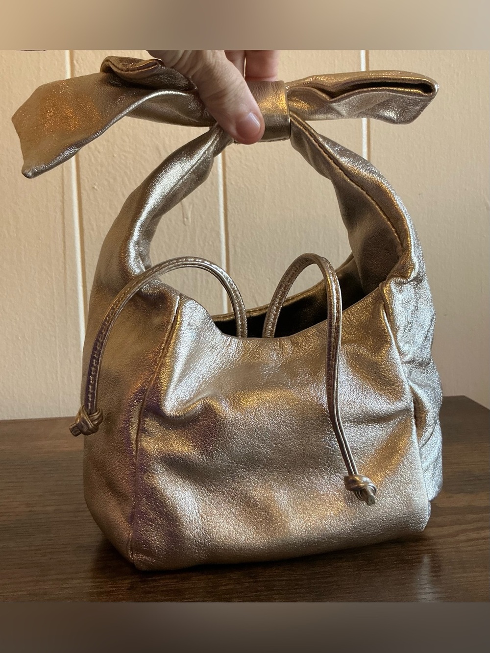 A Rare HTF Modern Vintage Metallic Rose Gold Leather Drawstring Pouch Handbag